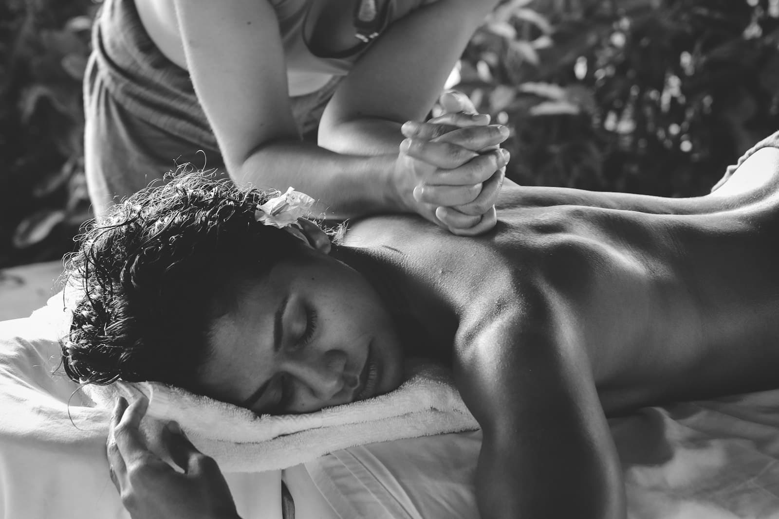 A patient resting through a calming recovery and bodywork session